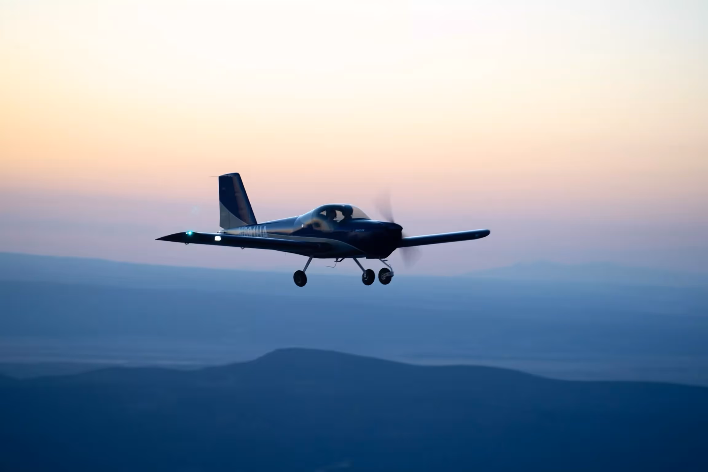 Hawkins Flight Academy aircraft flying over Mississippi landscape