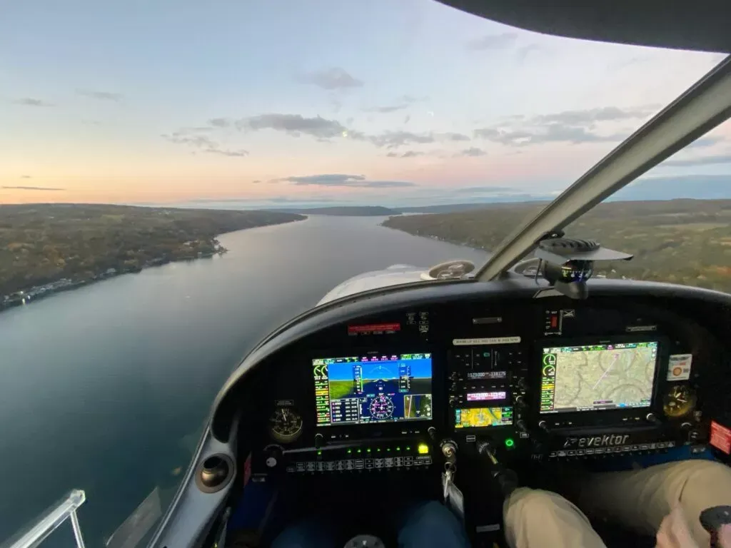 A small plane flying over Niagara Falls