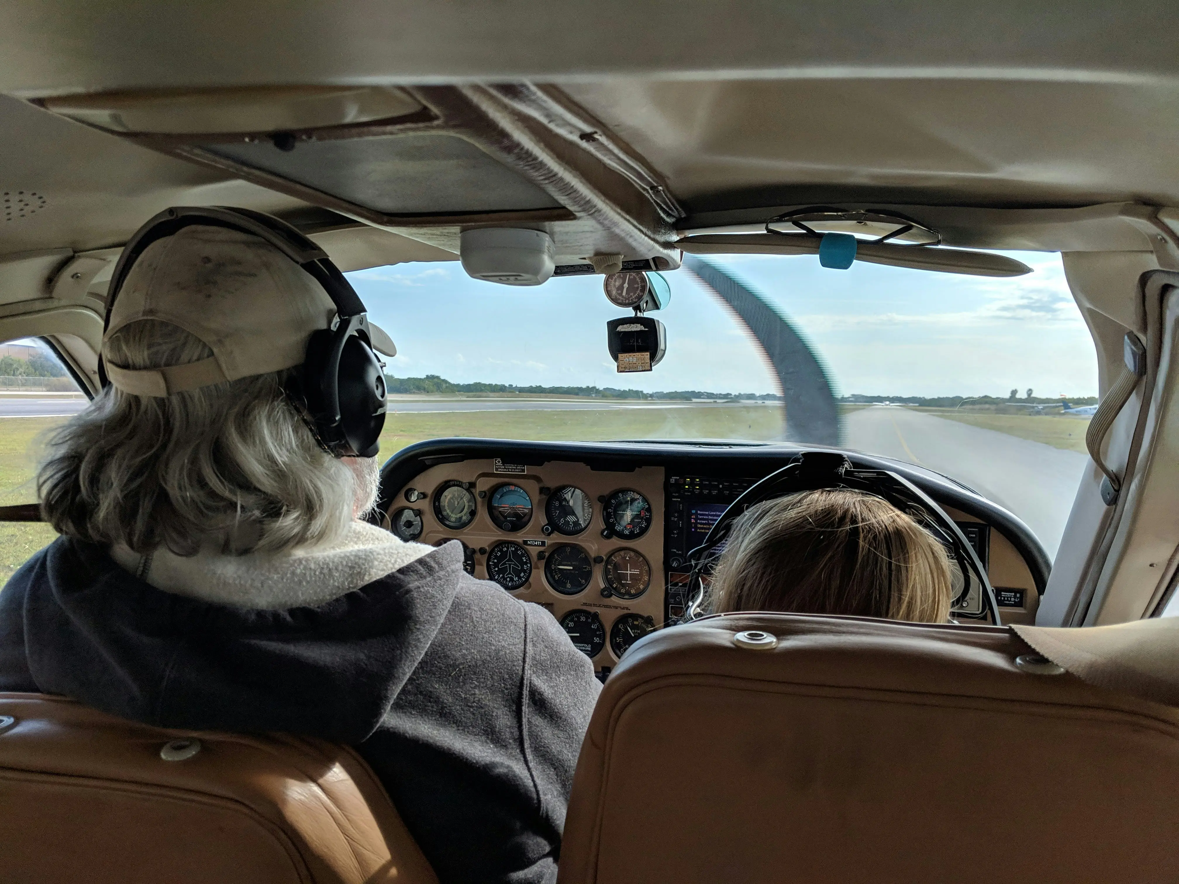 Flight instructor and student preflighting aircraft at Hawkins Flight Academy