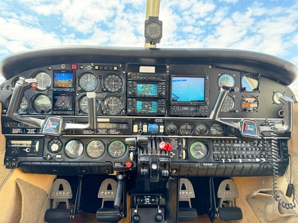 Cockpit instrument panel during a Hawkins Flight Academy training flight showing organized systems layout