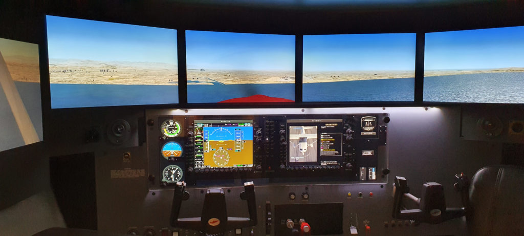 Redbird MCX simulator with G1000-style avionics used for instrument training at Hawkins Flight Academy