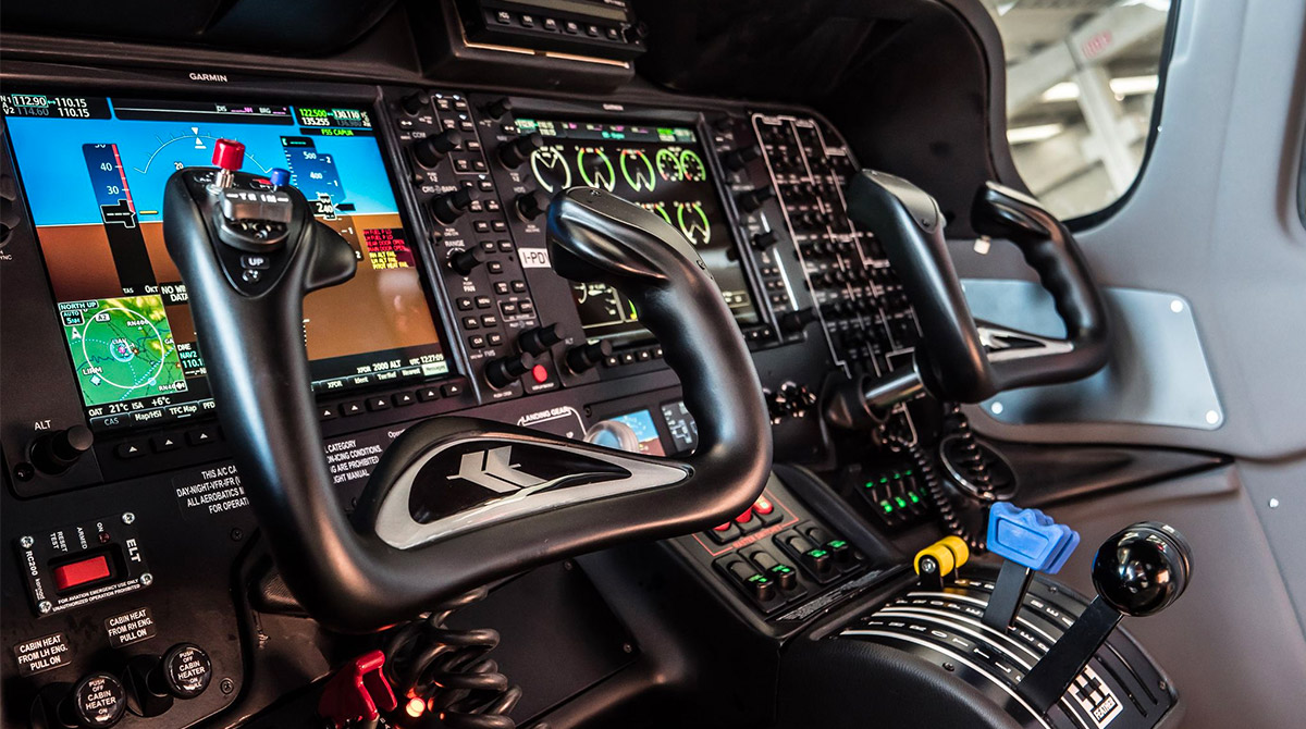 Reference Tecnam P2006T cockpit with dual yokes, electronic flight displays and engine controls