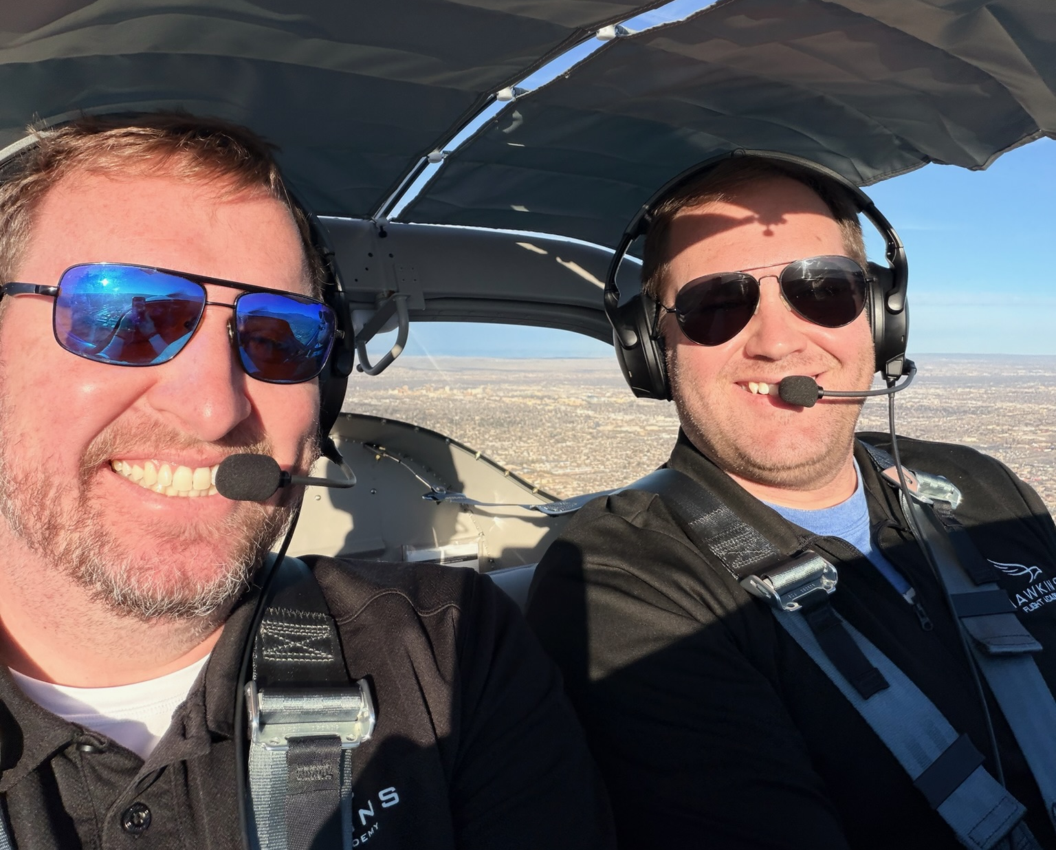 Two Hawkins Flight Academy pilots in the cockpit during a cross-country training flight